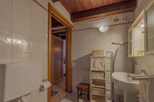 a bathroom with a sink and a bath tub at Appartamento Adèle- CIR 0063 in La Thuile