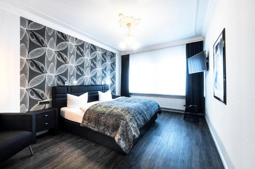a bedroom with a bed and a large window at Hochwald Lodge in Morbach