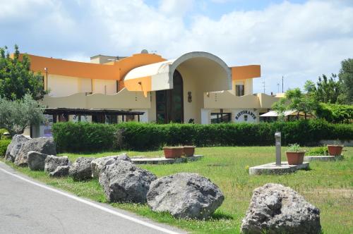 a building with some large rocks in front of it at Hotel Il Cavaliere in Sarno