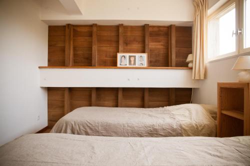 Кровать или кровати в номере Gîte des Grands Moulins de Baugé