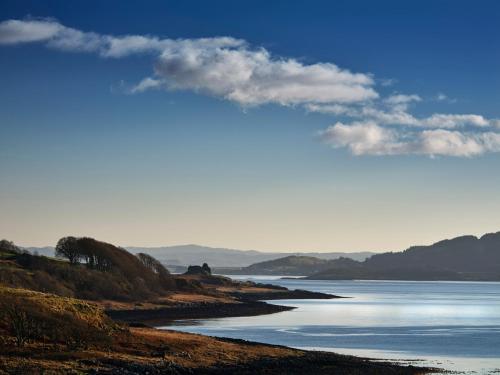 a view of a body of water with mountains in the background at White Watch in Lochaline