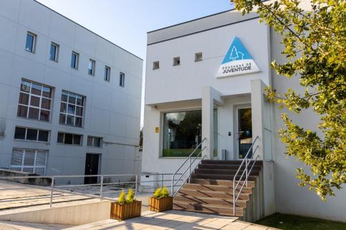 a building with aadobeadobe sign on the front of it at HI Viseu - Pousada de Juventude in Viseu
