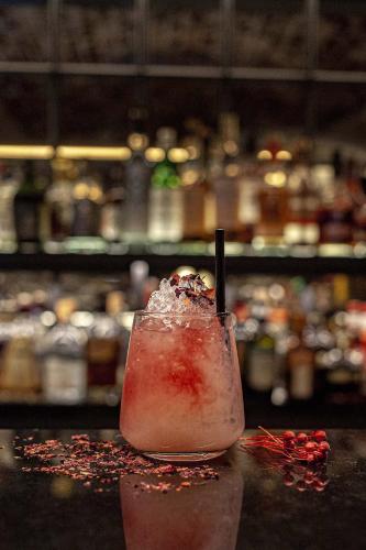 a drink sitting on top of a table at Hôtel Roi de Sicile - Rivoli in Paris