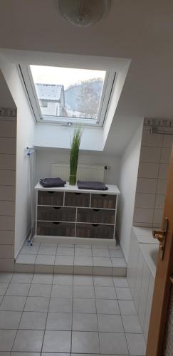 a skylight in a bathroom with a toilet and a sink at Ferienwohnanlage Brünnstein Wohnung 54 in Oberaudorf