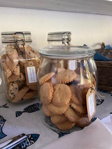 a group of cookies in jars on a table at Valle dei Mulini B&B in Marciana