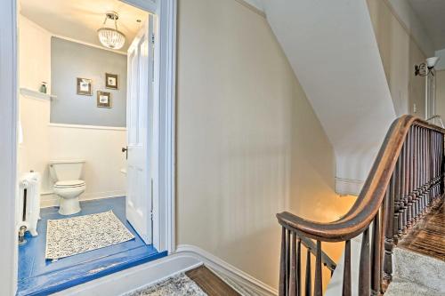 a bathroom with a staircase with a toilet in it at Historic Poughkeepsie Apt - Walkable Location in Poughkeepsie
