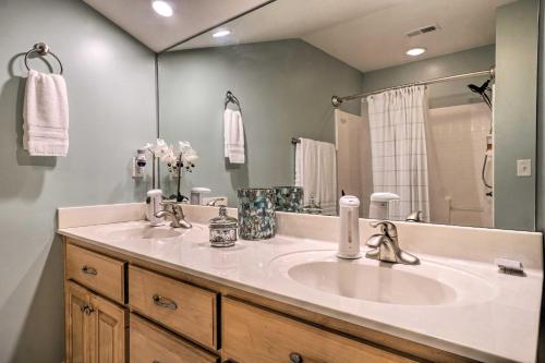 a bathroom with a sink and a large mirror at Cozy Young Harris Condo Near Lake Chatuge! in Young Harris