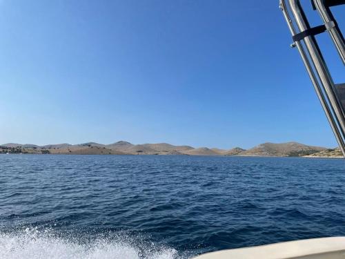 a view from the back of a boat in the water at Apartments Villa Lora in Kraj