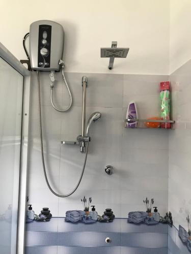 a bathroom with a shower with a shower head at Villa Bubble Sea in Unawatuna