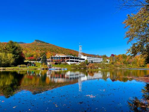 a view of a lake with a building in the background at Indian Head Resort in Lincoln
