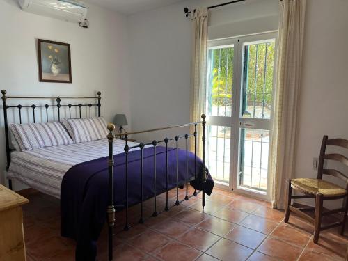 Un pat sau paturi într-o cameră la Casa Mari Carmen