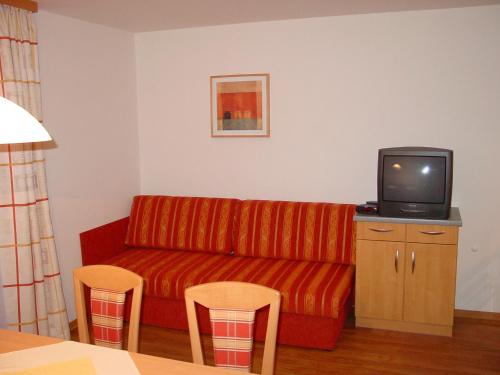 TV a/nebo společenská místnost v ubytování Ferienhaus Kaml Franz