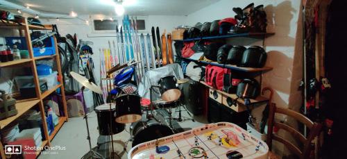 a room with a bunch of ski equipment in it at Nina`s GuestHouse, Jämsä City, 160 m2, Include x2 Himos Ski Pass in Jämsä
