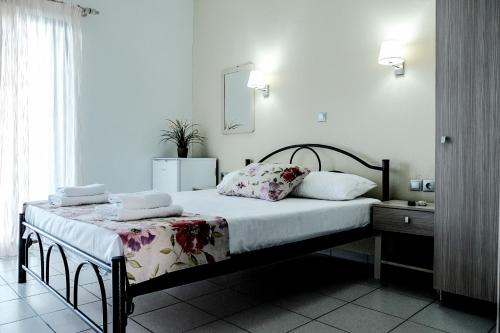מיטה או מיטות בחדר ב-Katerina's rooms