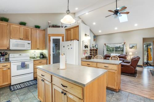 a kitchen with wooden cabinets and a white refrigerator at The Hidden Treasure in Warrenton