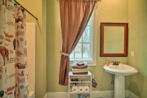 a bathroom with a sink and a window at Dog-Friendly Family Home Steps to Norris Lake in Maynardville