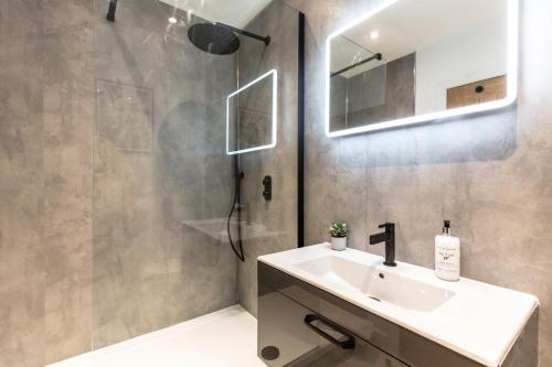 a bathroom with a sink and a shower at The Penthouses, 9 Albion Mews in Chester