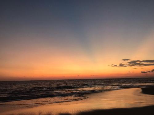 Amanecer o atardecer desde la casa vacacional o alrededores