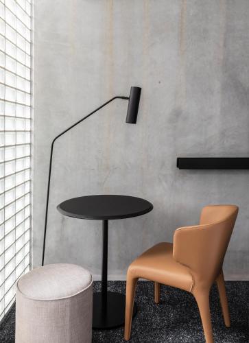 a table and a chair in a room at Lancemore Crossley St. Melbourne in Melbourne