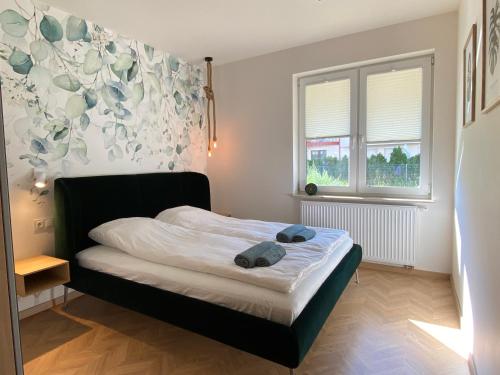 Voodi või voodid majutusasutuse Apartament Baltic Premium Garden z ogródkiem toas