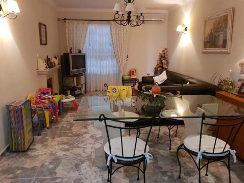 a living room with a table and chairs at Altura Beach House in Altura