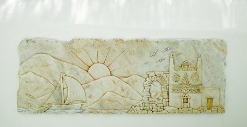 a drawing of a beach with a sail boat and a lighthouse at Mata's Apartments in Tinos Town