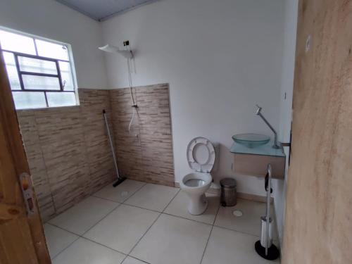 Ванная комната в Sítio Zen 37 hectares de flora e fauna preservadas, a 50" da Capital, com wifi 30mbps!