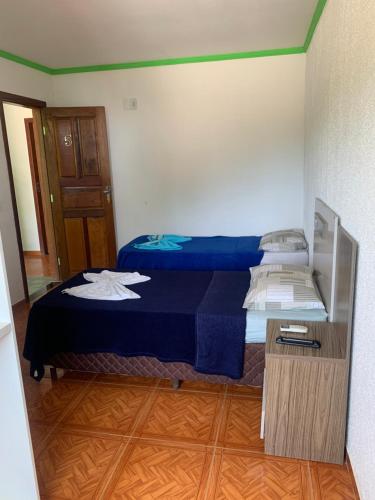 Katil atau katil-katil dalam bilik di Pousada estância gaúcha