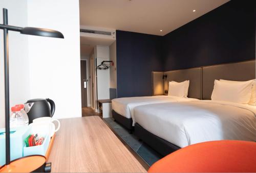 Postel nebo postele na pokoji v ubytování Holiday Inn Express Yangjiang City Center by IHG