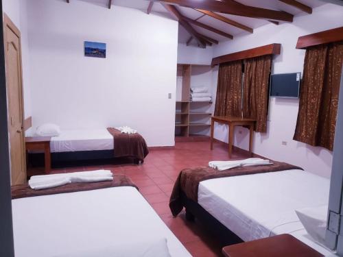 Postel nebo postele na pokoji v ubytování Hotel Crossman