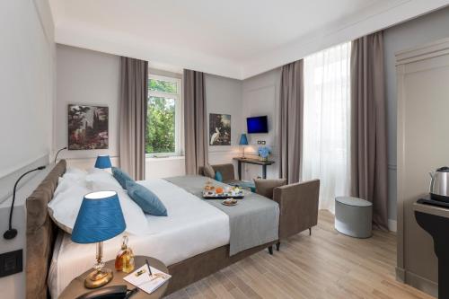 Postel nebo postele na pokoji v ubytování Hotel La Ville Rome