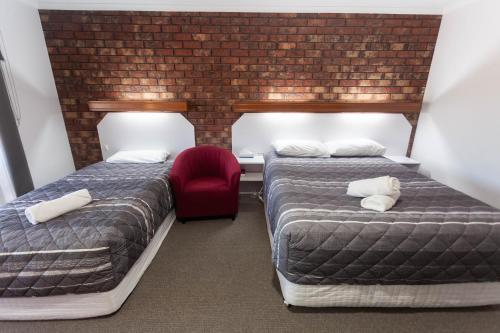 Ένα ή περισσότερα κρεβάτια σε δωμάτιο στο Donald Motor Lodge