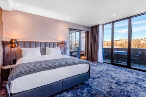 Кровать или кровати в номере Taberne Boutique Hotel Tbilisi