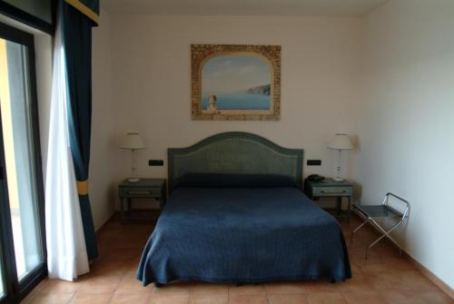 מיטה או מיטות בחדר ב-Hotel Club Sabbiadoro