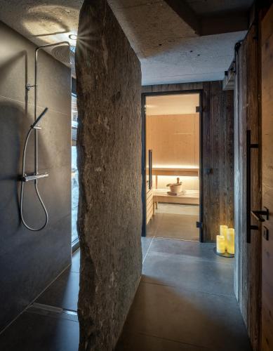 a bathroom with a shower and a toilet in a room at ALM CHALET in Annaberg im Lammertal