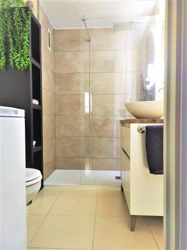 a bathroom with a shower and a sink at ESPIGALL in Vilanova i la Geltrú