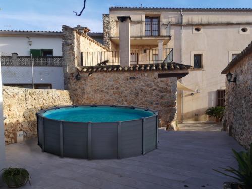 a swimming pool in front of a building at Pina in Pina