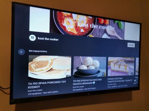 a television screen with a presentation of food on it at Country House in Sozopoli