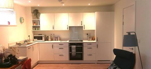 A kitchen or kitchenette at Apartment one Estuary Reach