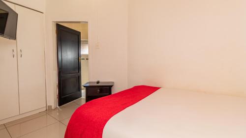 Ένα ή περισσότερα κρεβάτια σε δωμάτιο στο See You There Accommodation 2