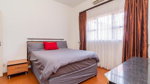 Ένα ή περισσότερα κρεβάτια σε δωμάτιο στο See You There Accommodation 2