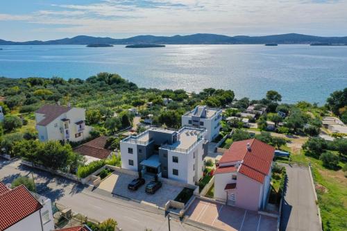 an aerial view of houses and the water at Villa Marija in Sveti Filip i Jakov