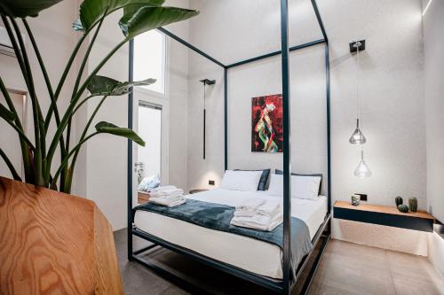 Postel nebo postele na pokoji v ubytování FICOPALA SUITES