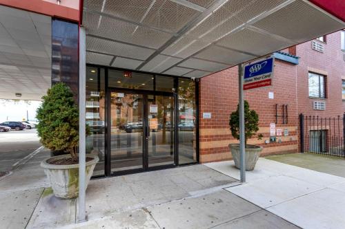 an entrance to a building with glass doors at Comfort Inn Brooklyn in Brooklyn