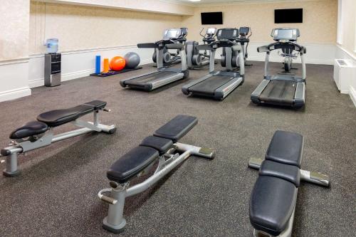 a gym with several exercise bikes and weights at Natural Bridge Hotel, Trademark Collection by Wyndham in Natural Bridge