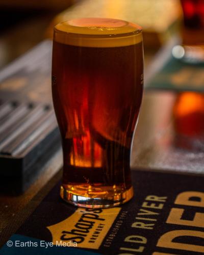 a glass of tea sitting on a table at The Bear Inn in Llandovery