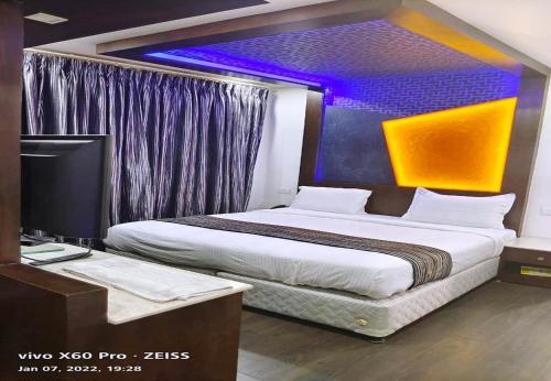 Postel nebo postele na pokoji v ubytování Hotel M Grand