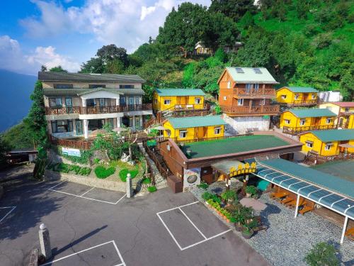 an aerial view of a resort with a parking lot at Emmanuel Farm House in Renai