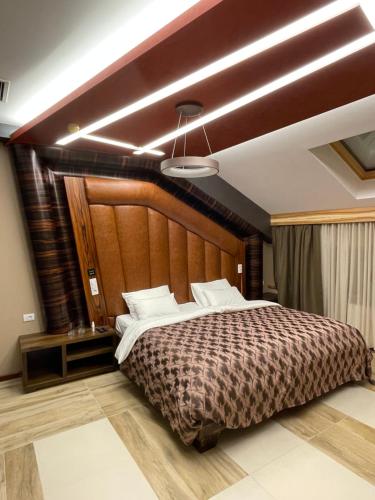 Postel nebo postele na pokoji v ubytování Hotel Havana Loznica