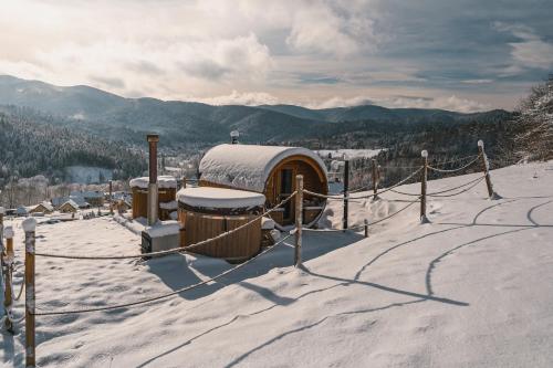 a snow covered observatory on top of a mountain at Pod Brzozka in Cisna